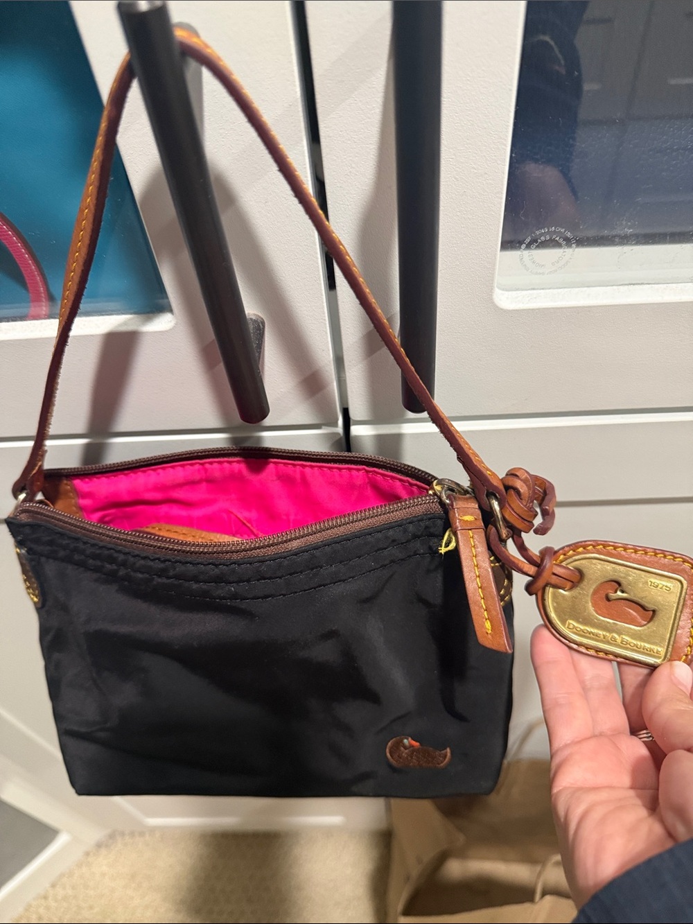 Dooney & Bourke Black Nylon Wristlet with Brown Leather Trim and Pink Interior